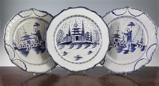 A pair of pearlware blue and white dishes and another similar pearlware dish, late 18th century, both diam. 35.5cm